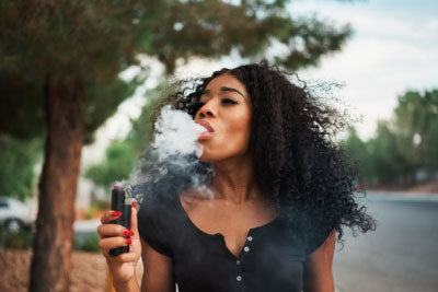 Woman Vaping CBD Without Nicotine